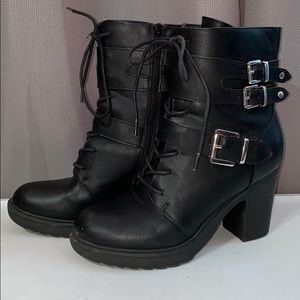 Black heeled combat booties